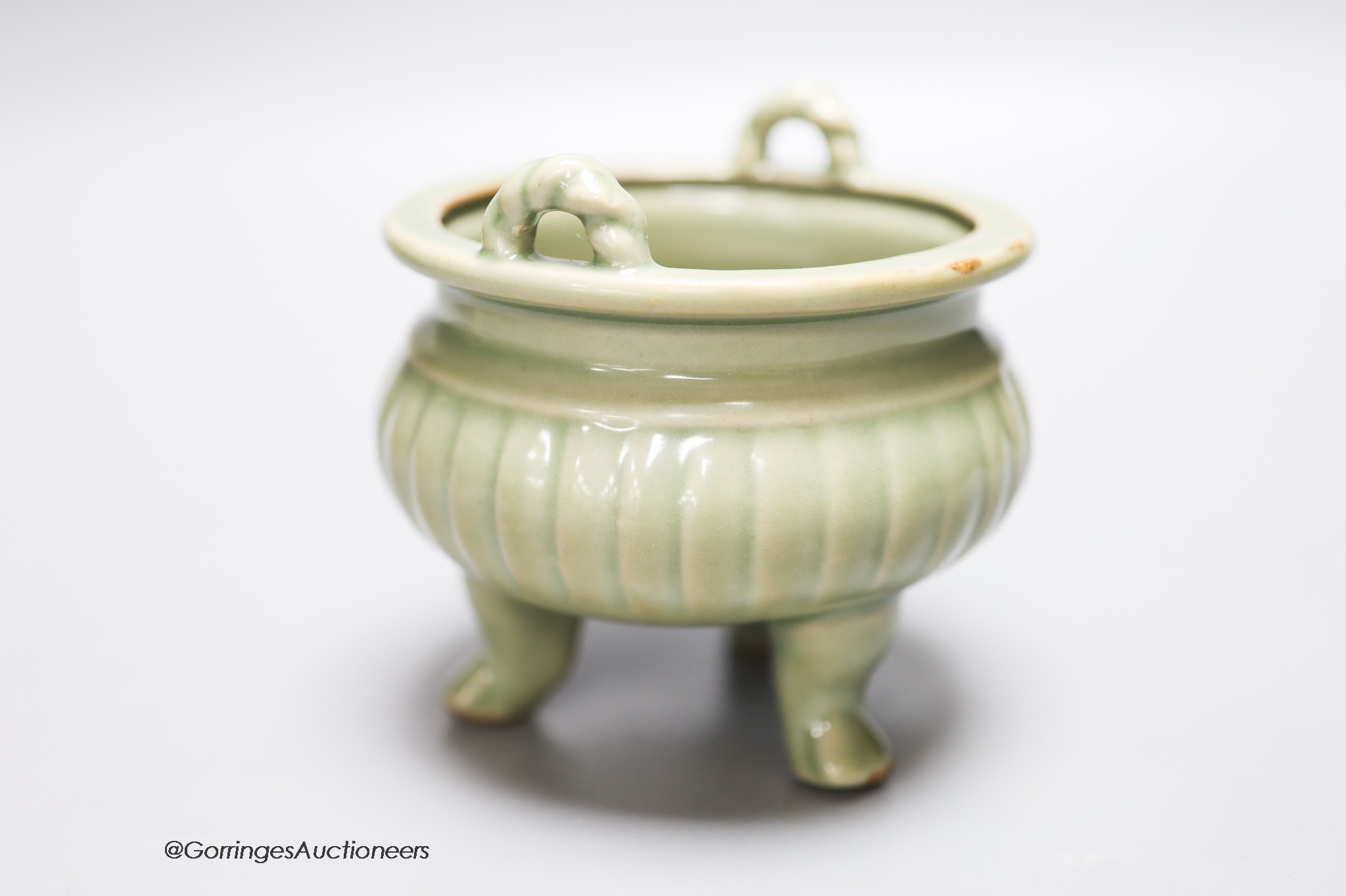 A Chinese celadon tripod censer, height 11.5cm